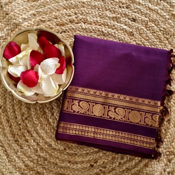 Wine-purple Kanchipuram silk-cotton saree with peacock zari border